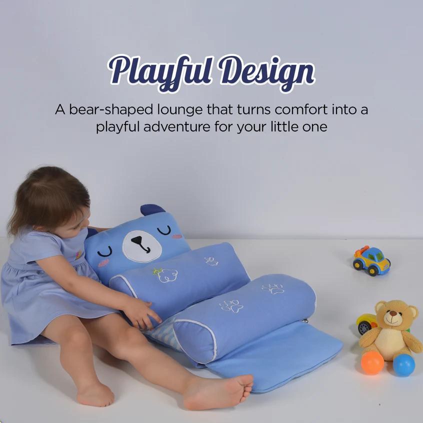 A toddler playing with the pillow